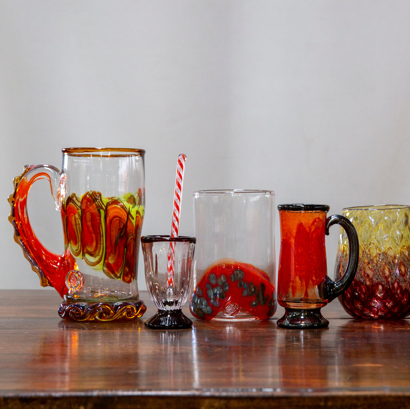 The image showcases a selection of red drinkware that Happy Hour class participants may use for inspiration.