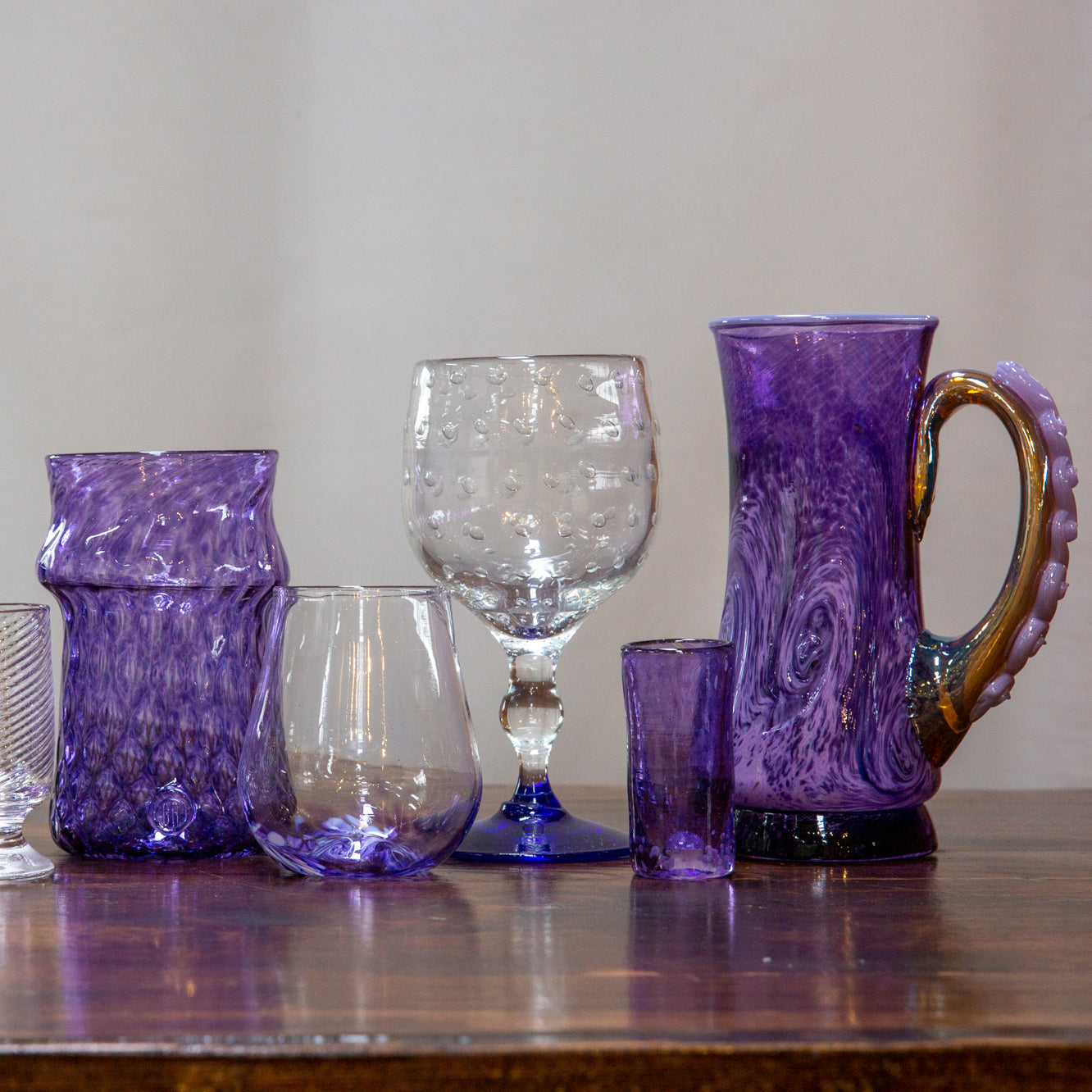 The image showcases a selection of purple drinkware that Happy Hour class participants may use for inspiration.
